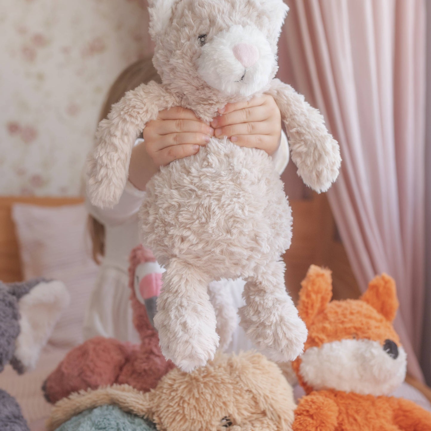 Child with all her weighted plush toys