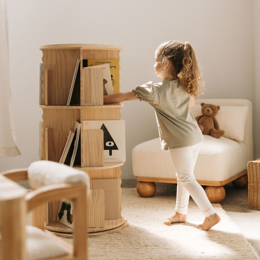 Nuage Interiors - Girl playing with bookshelf