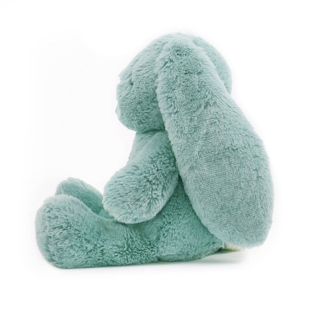 Plush toy elephant in light blue on a white background side view