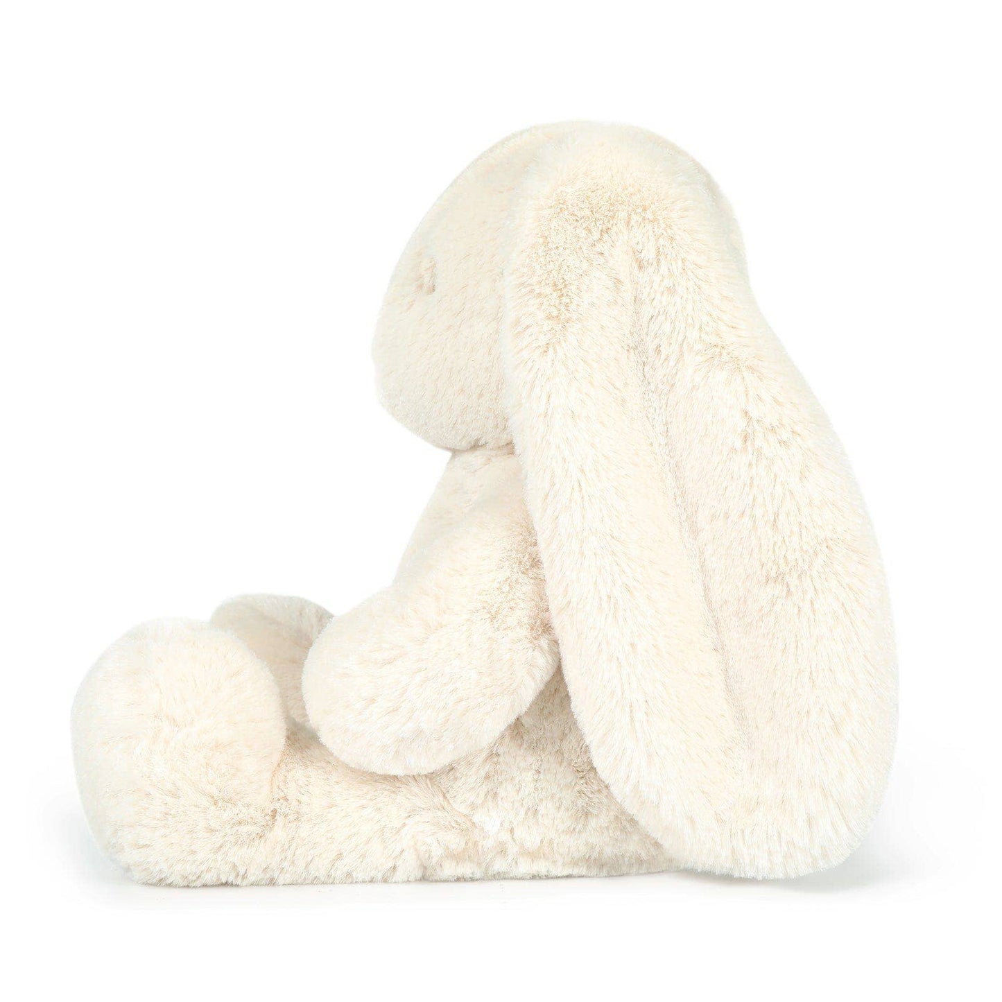 White plush bunny toy on a white background side view