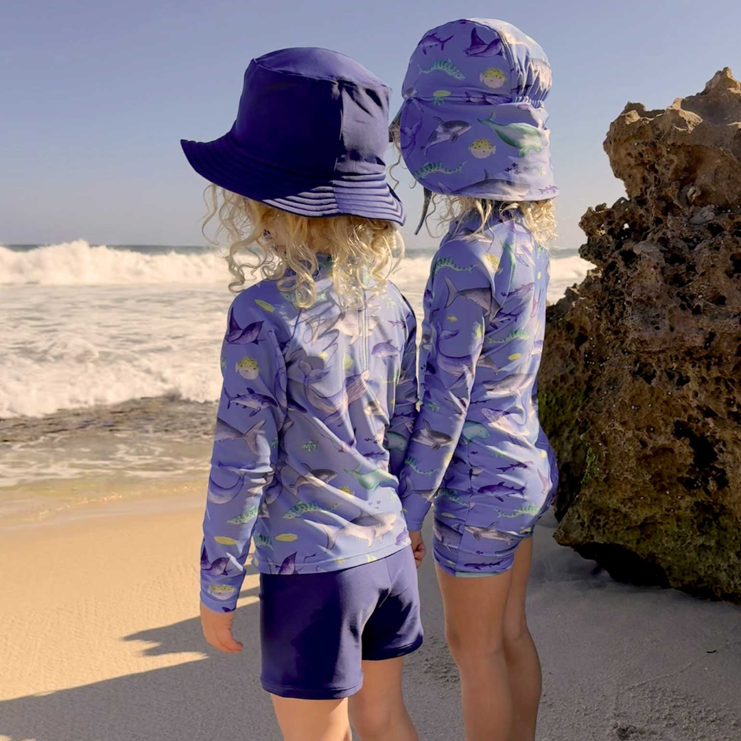 Pure Baby - Children at the beach with Shark Swimmers and Hat