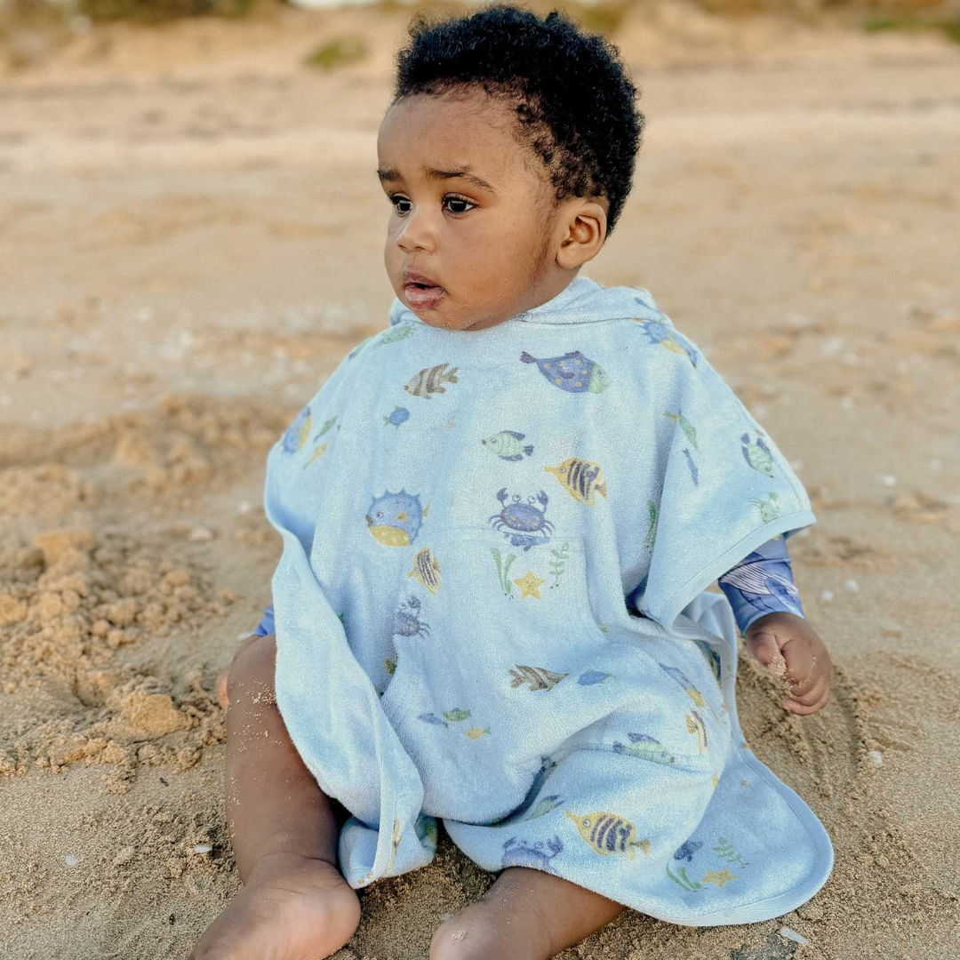 Pure Baby - Toddler on the beach with towel poncho