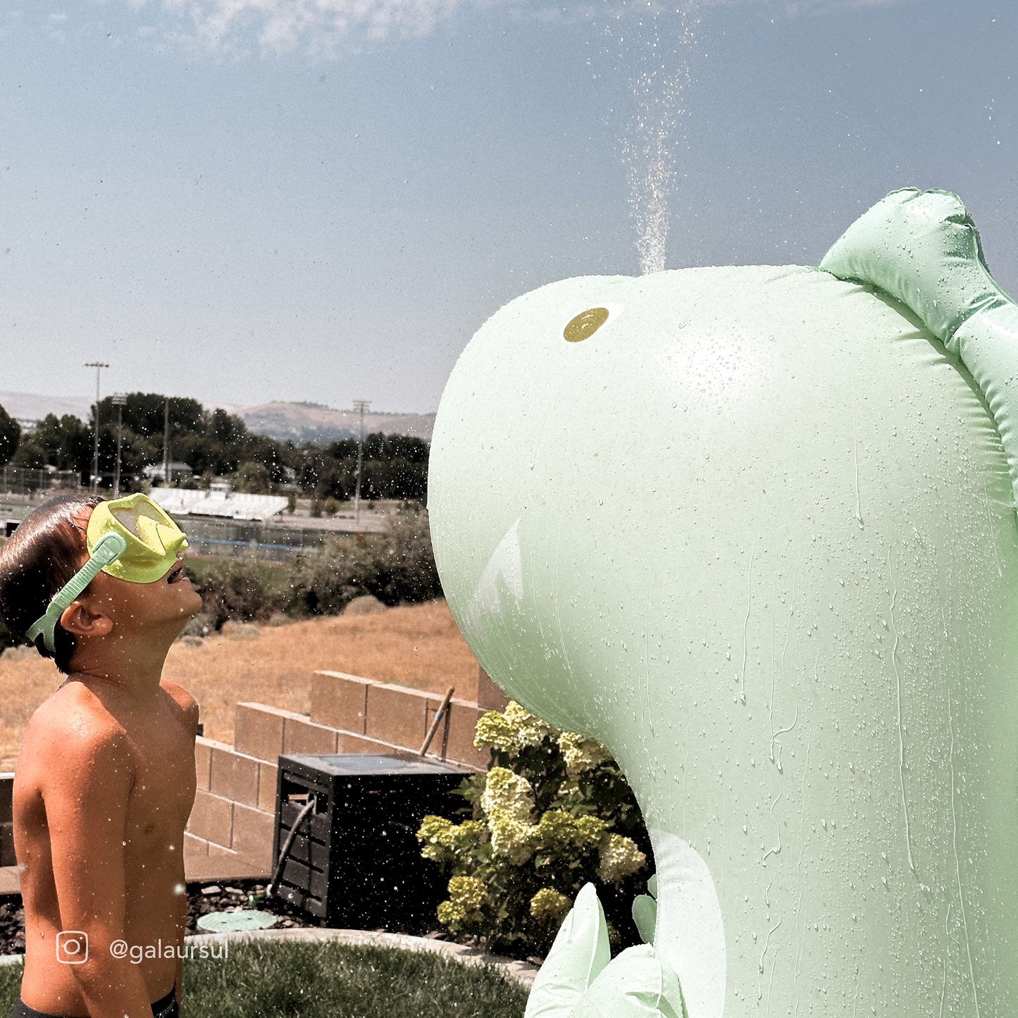 Inflatable Giant Sprinkler Surfing Dino