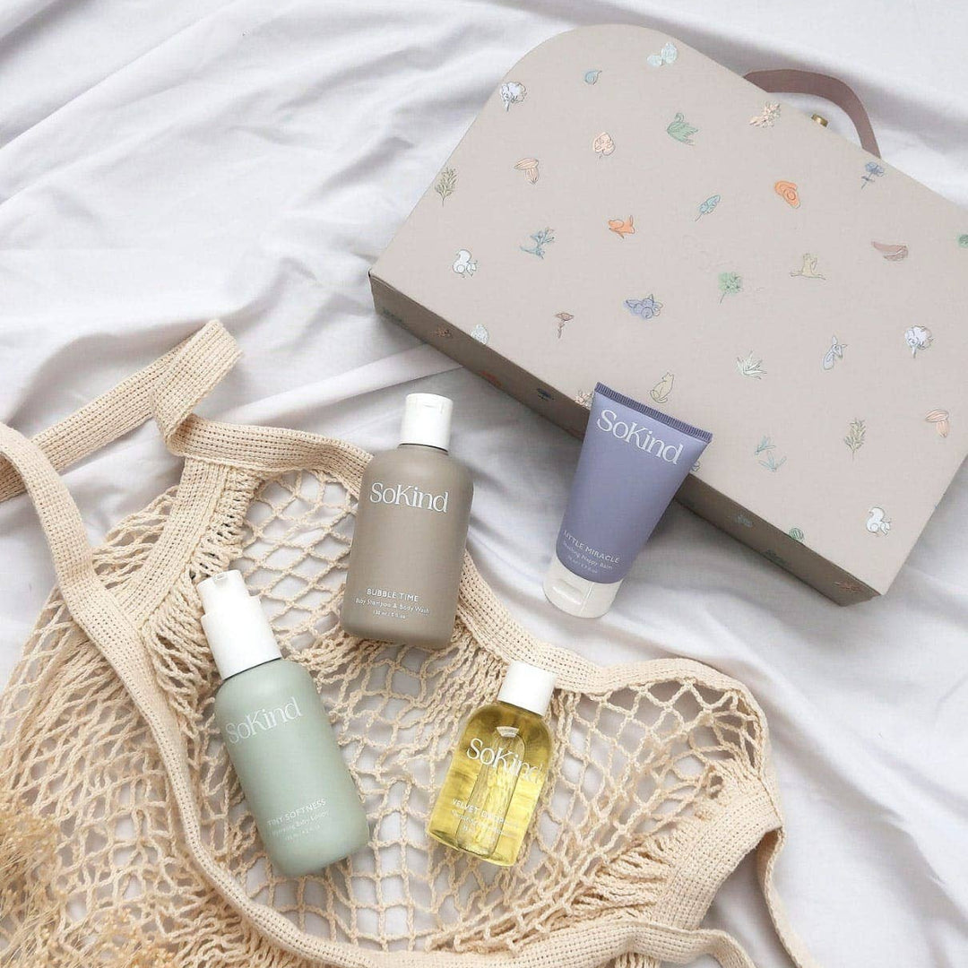 Skincare products and a net bag on a white background