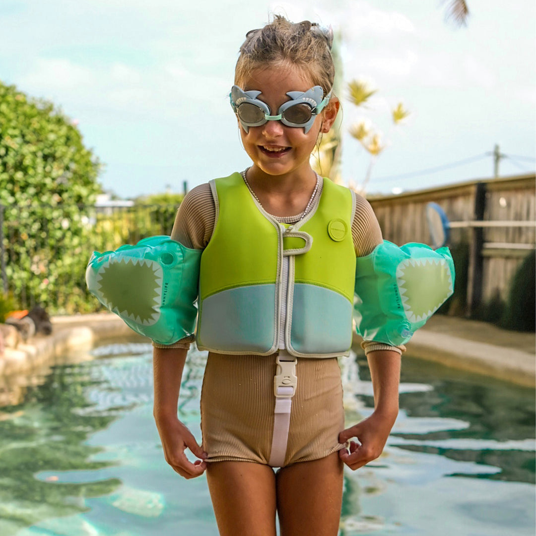 Girl in Sunnylife Swim Vest at the pool